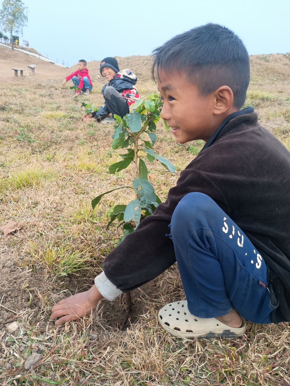 A boy is seen planting a tree sapling during the plantation drive organized by the Assam Rifles at Wonthoi village, Noklak on February 3. As part of the drive, a total of 50 saplings were planted by participants. The initiative was aimed to raise awareness among the civilians about the importance of preserving the environment & protecting planet Earth. This highlighted the need for sustainable practices & instilled a sense of responsibility towards nature amongst future generations.